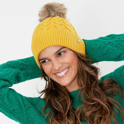 Bonnet à Pompon en Fausse Fourrure et Torsades Elena moutarde JOULES